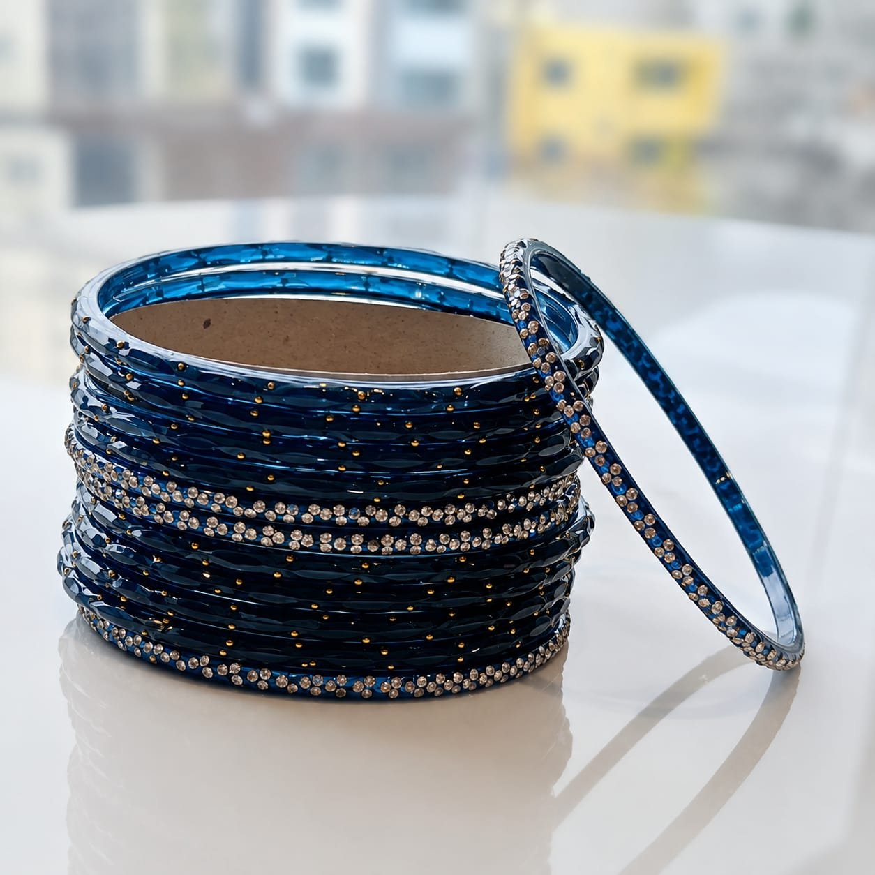 Premium royal Blue glass bangle set (traditionally known as Kanch ki Chudi) accented with intricate gold zircon stones and miniature beadwork. [