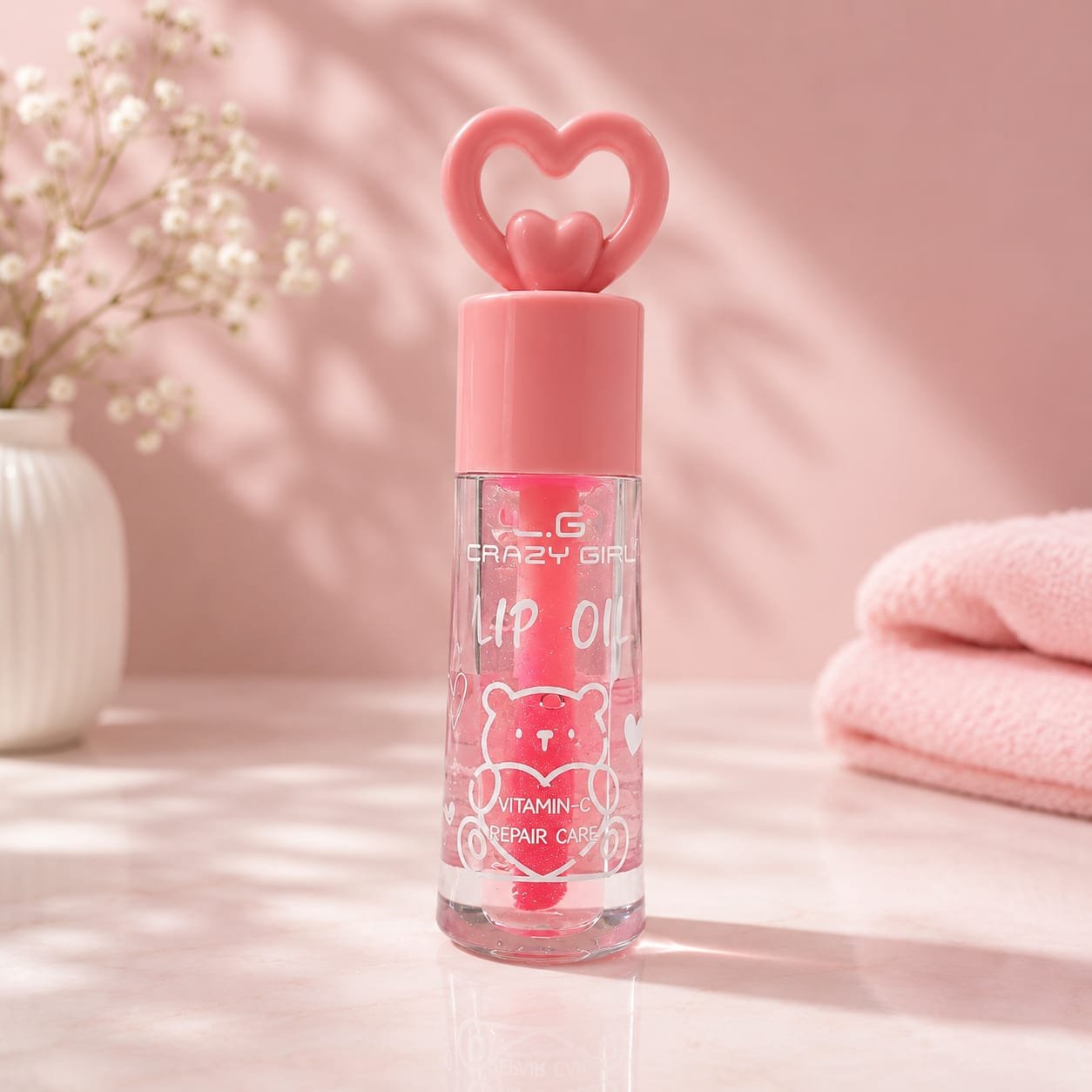 Crazy Girl Lip Oil features a cute pink heart-shaped cap and a vitamin-C repair formula.