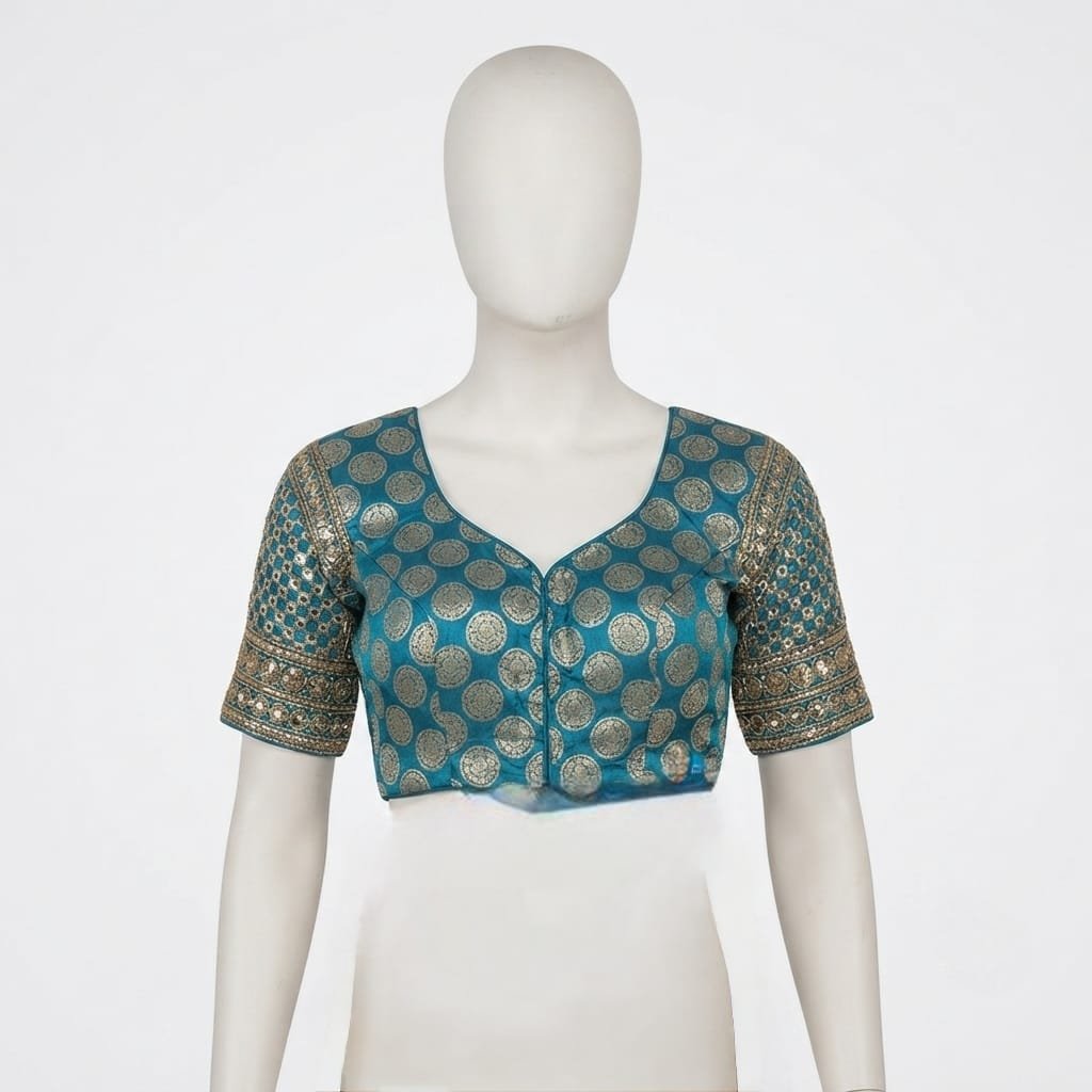 Readymade Teal and gold brocade blouse features a classic round neck and intricate traditional patterns.