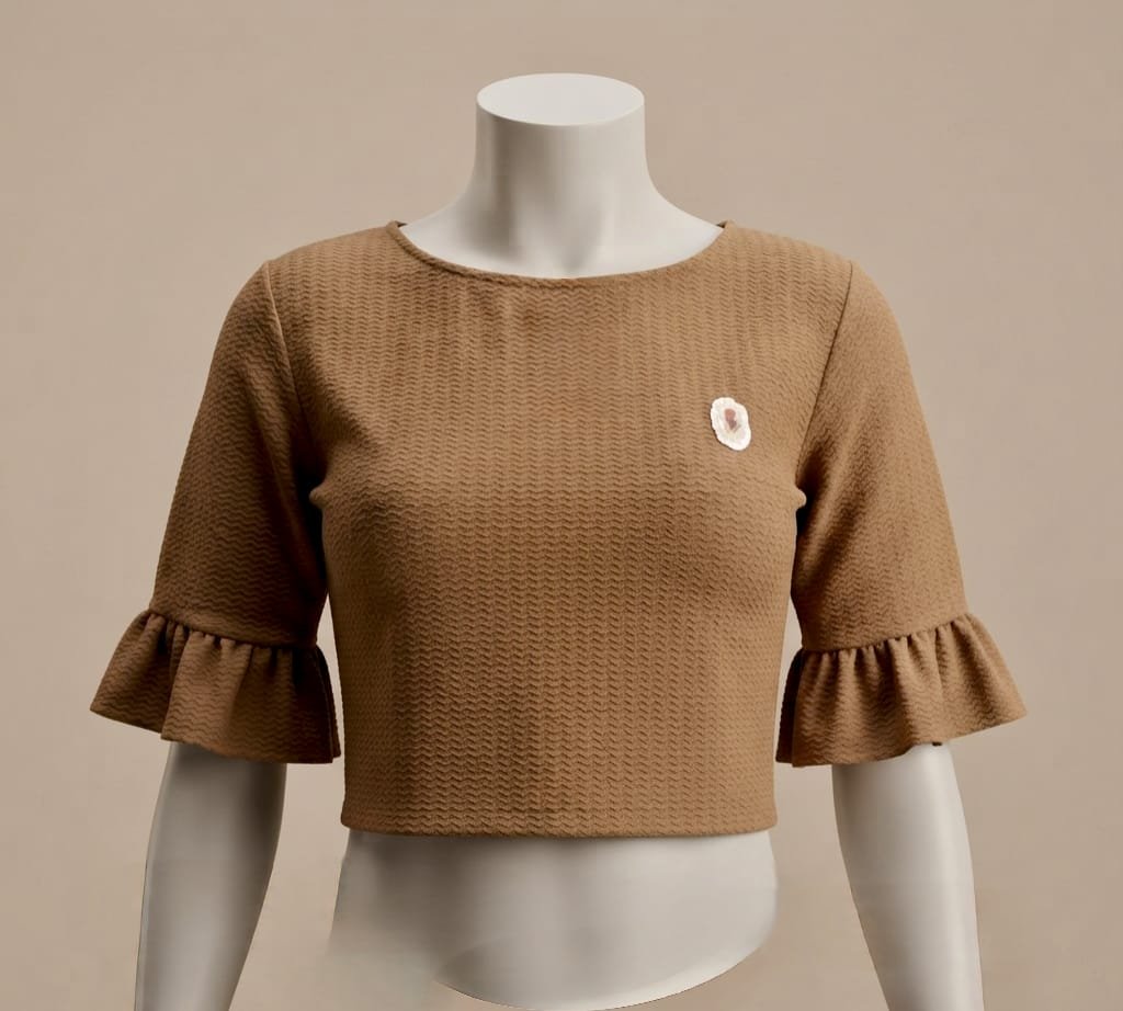 women's brown textured crop top styled with mid-length bell sleeves.