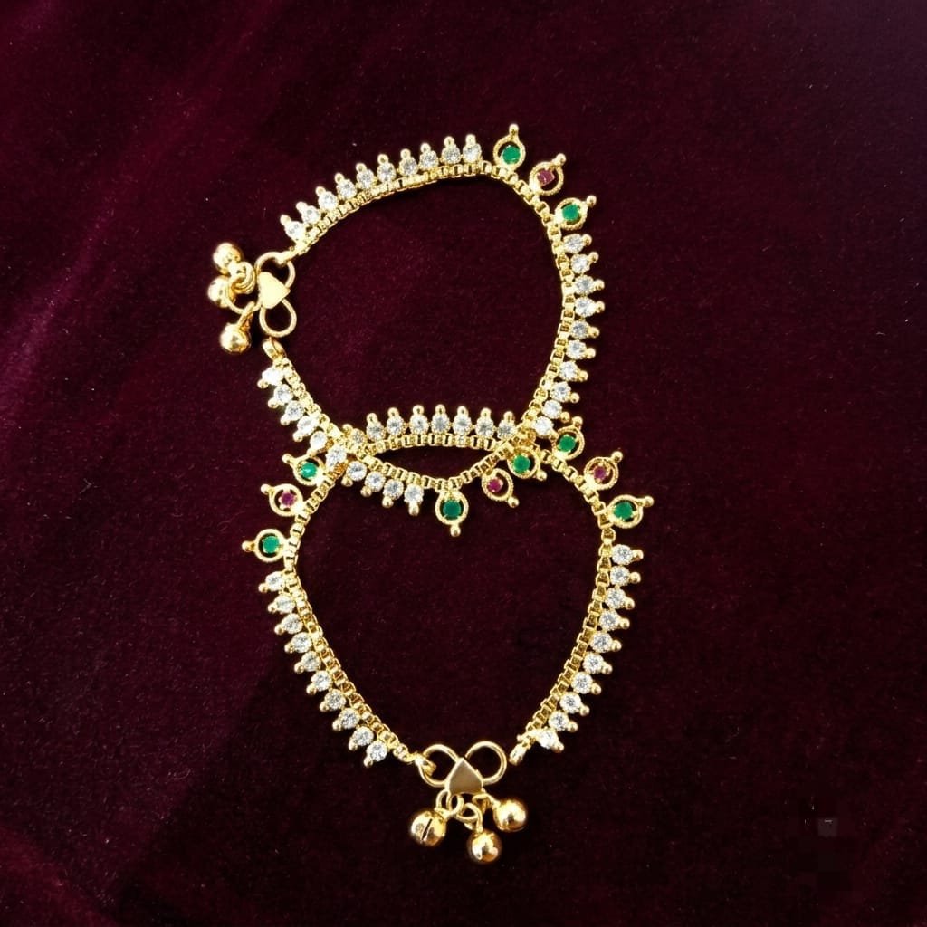 A pair of gold-finished traditional Indian anklets